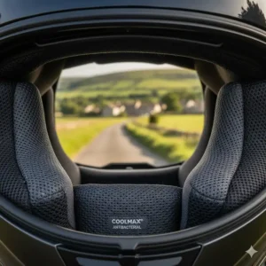 Close-up of a breathable, moisture-wicking mesh liner inside a ventilated motorcycle helmet.