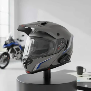 A touring-style motorcycle helmet featuring an aerodynamic peak and a drop-down sun visor for long-distance riding.