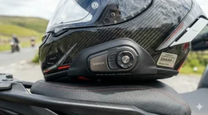 A premium helmet showing seamless integration ports for Cardo or Sena Bluetooth communication systems.