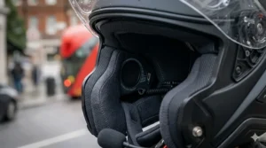 Alt text for image 9: A macro shot of the chin bar ventilation on a motorcycle helmet, designed to defrost the visor and provide fresh air during cold UK morning rides.