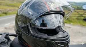 A clear visor featuring a Pinlock 120 Max Vision anti-fog insert, essential for damp UK riding conditions.