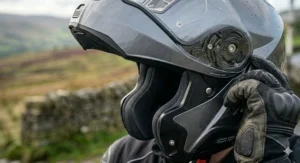 A modular motorcycle helmet in the open position, illustrating versatility for urban riding in changing UK weather conditions.