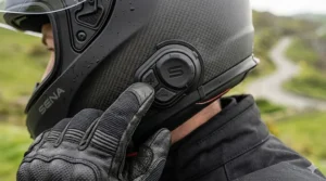 Close-up of the tactile glove-friendly buttons on a Sena integrated bluetooth helmet for easy volume adjustment.