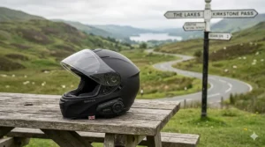 A matte black full-face Sena integrated bluetooth helmet designed for touring and high-speed UK motorway riding.
