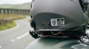 Rear view of a modern motorbike helmet with ECE 22.06 and BSI Kitemark safety certification.