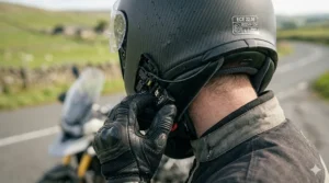 Detail shot of the ECE 22.06 safety certification label on the rear of a premium motorcycle helmet, confirming adherence to the latest European safety standards.