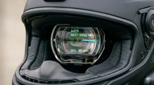 Close-up of internal speakers and microphone inside a smart motorcycle helmet.