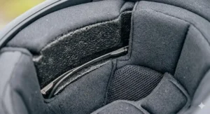 Close-up of the internal helmet padding featuring dedicated cut-away channels to accommodate spectacle frames for a pressure-free fit.