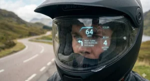 Close-up of a HUD helmet visor showing speed and sat-nav directions.