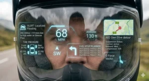 Technician installing a small HUD module into a motorcycle helmet.