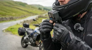 A rider’s point-of-view (POV) shot through the vlogging helmet showing an open British A-road and countryside scenery.
