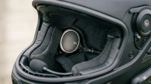 Rear-facing safety camera mounted on the back of a sleek smart motorcycle helmet.