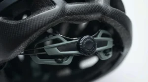Detailed view of the adjustable chin strap on a women’s lightweight carbon fibre helmet.