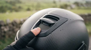 An illustration showing the adjustable intake and exhaust vents on the fibreglass touring helmet for rider comfort.