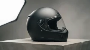 Front view of fibreglass motorcycle helmet with clear scratch-resistant visor.