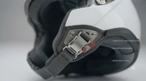 Secure chinstrap fastening system on a fibreglass touring helmet meeting UK safety standards.