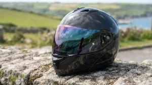 Close-up of an anti-scratch mirror tinted visor showing UV protection and iridescent finish.