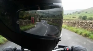 Rider's perspective looking through a dark smoke visor on a sunny British afternoon ride.
