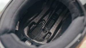 Moisture-wicking removable inner lining of an injected polycarbonate helmet for effortless washing and comfort.
