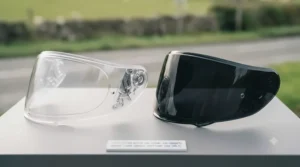 Side-by-side comparison of a UK legal clear visor versus a tinted motorcycle visor.