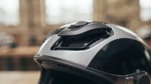 Top and brow ventilation ports on an injected polycarbonate helmet designed for airflow on British roads.