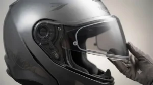 A photochromic visor fitted securely onto a premium touring motorcycle helmet.