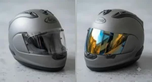 Side-by-side comparison of a reflective iridium visor and a transparent clear motorbike visor