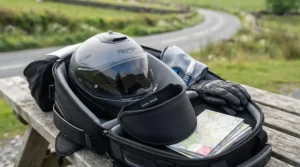 Flat lay of motorcycle touring gear showing how a photochromic visor removes the need to pack spare visors.