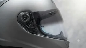 Close-up of a replacement photochromic visor demonstrating how the tint darkens in bright sunlight.