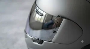 Close-up side profile of a silver mirrored iridium visor showing anti-scratch coating