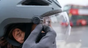A universal-fit photochromic visor attached securely to a standard urban cycling helmet used by UK commuters