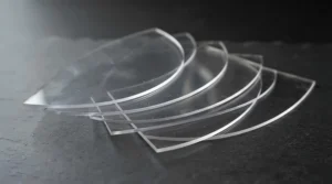 A multi-pack tear-off visors collection showing clear layered sheets for racing goggles
