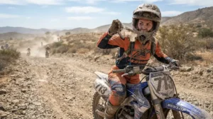Dusty trail conditions managed with universal tear-offs for motocross goggles